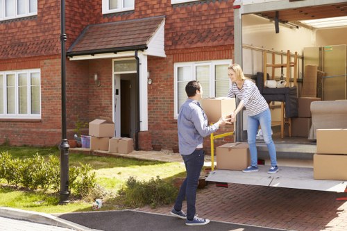 Local home removals support in Enfield with moving van and packed boxes