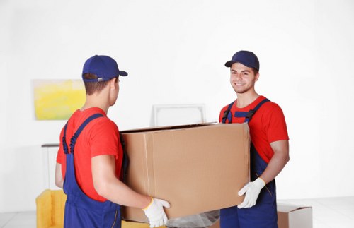 Removal team loading boxes and furniture for a house move