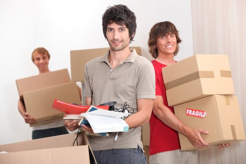 Local removals team supporting a move in Enfield with boxed household items