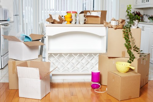 Local moving team packing household items for an Enfield relocation