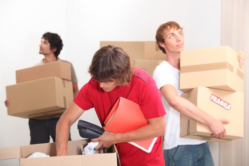 Packed boxes and household items arranged inside a moving truck