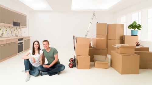 Removalists loading furniture and boxes for an Enfield home relocation