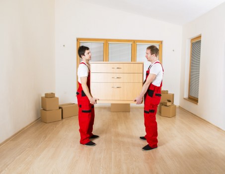 Moving team loading furniture into a van in Enfield