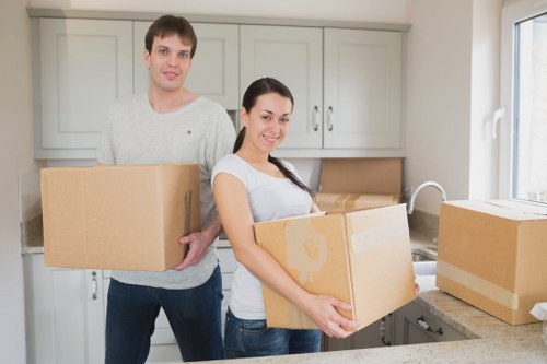 Moving boxes and furniture prepared for a local Enfield relocation